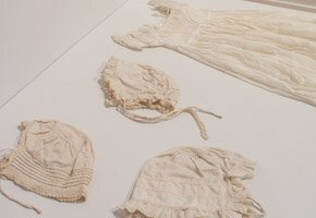 Baby's caps and Christening gown