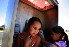Photograph, children in a phone box